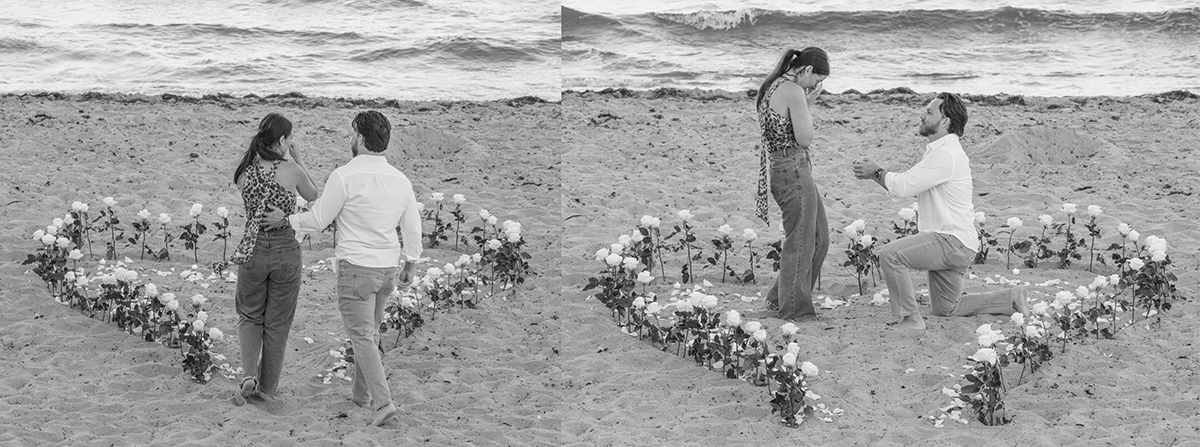“Black-and-white diptych of a beach marriage proposal. A couple stands inside a heart made of ivory roses on the sand. In the second frame, the man kneels on one knee while the woman covers her face in surprise as waves roll in behind them.”
