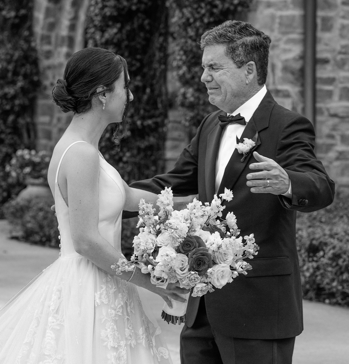 Bride and her emotional father share a heartfelt first look moment in the courtyard at Parkland Country Club, captured by South Florida wedding photographer Jeff Kolodny.