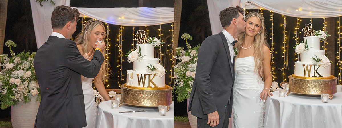 Groom kissing bride on the cheek beside their wedding cake under string lights at the end of a Fort Lauderdale wedding reception.