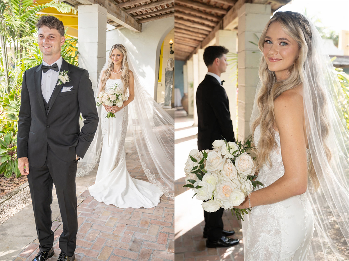 Bride and groom during first look wedding reveal with bride holding white rose bouquet and groom slightly turned in profile under covered walkway.