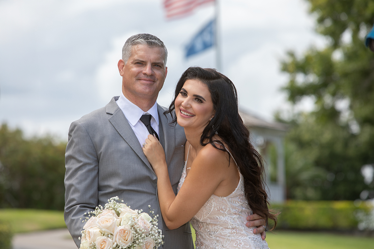 Joyful newlyweds embrace during a wedding at The Club at Boca Pointe, captured by an expert Boca Raton wedding photographer.