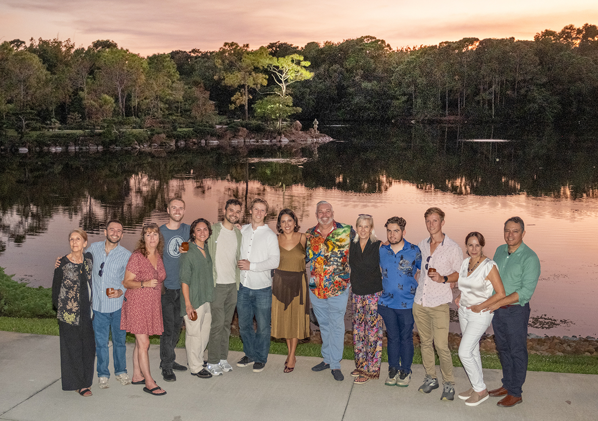 Group sunset portrait photographed by an LGBTQ+ proposal photographer at Morikami Museum after Steve and Sam’s surprise marriage proposal in Delray Beach, Florida.