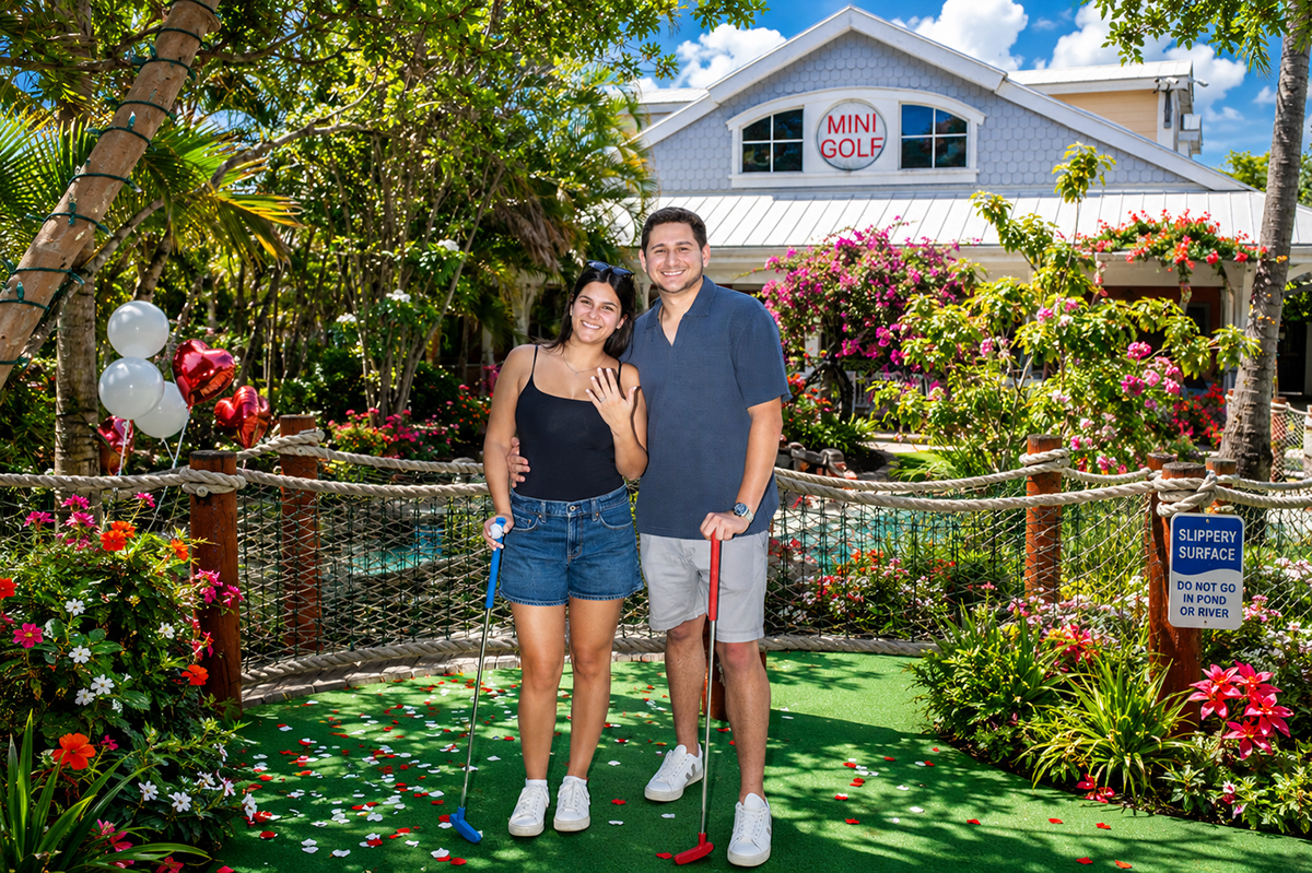 Delray Beach marriage proposal photographer captures Jacob and Lauren celebrating their engagement at Putt'n Around Delray Beach surrounded by tropical landscaping and miniature golf attractions.