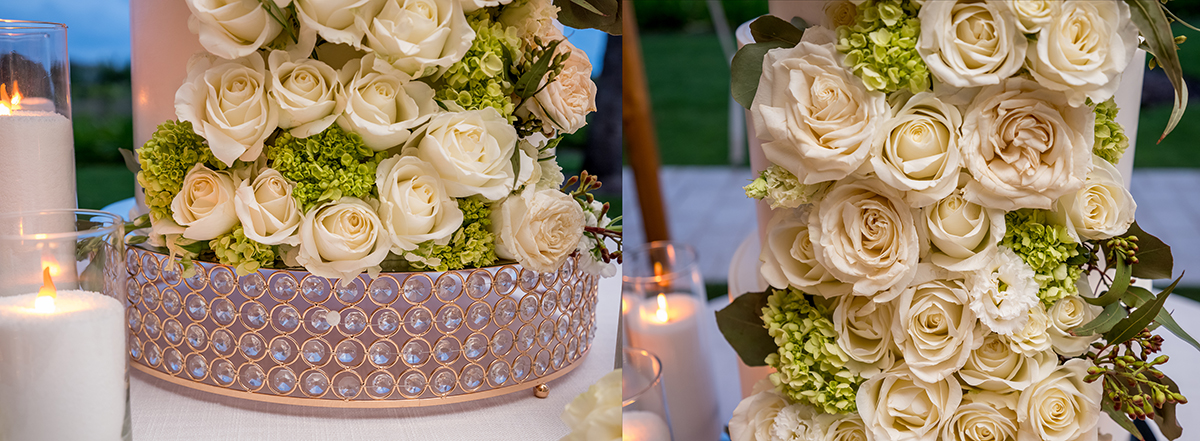 Close-up details of an elegant wedding cake covered with white roses, green hydrangeas and a crystal-accented base.