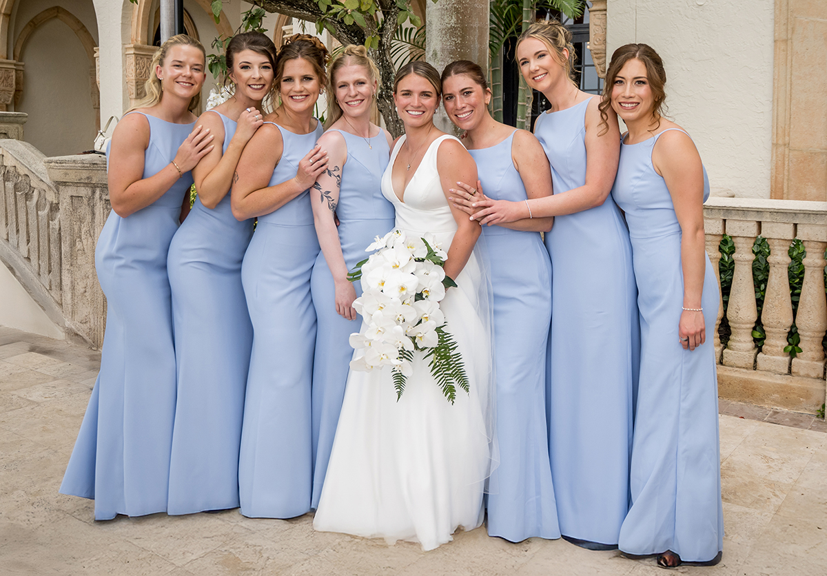 Bride with her bridesmaids in light blue dresses during a wedding at The Boca Raton.